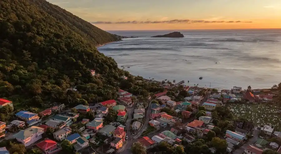 Aerial view of Soufrière village and bay at sunset, Dominica
